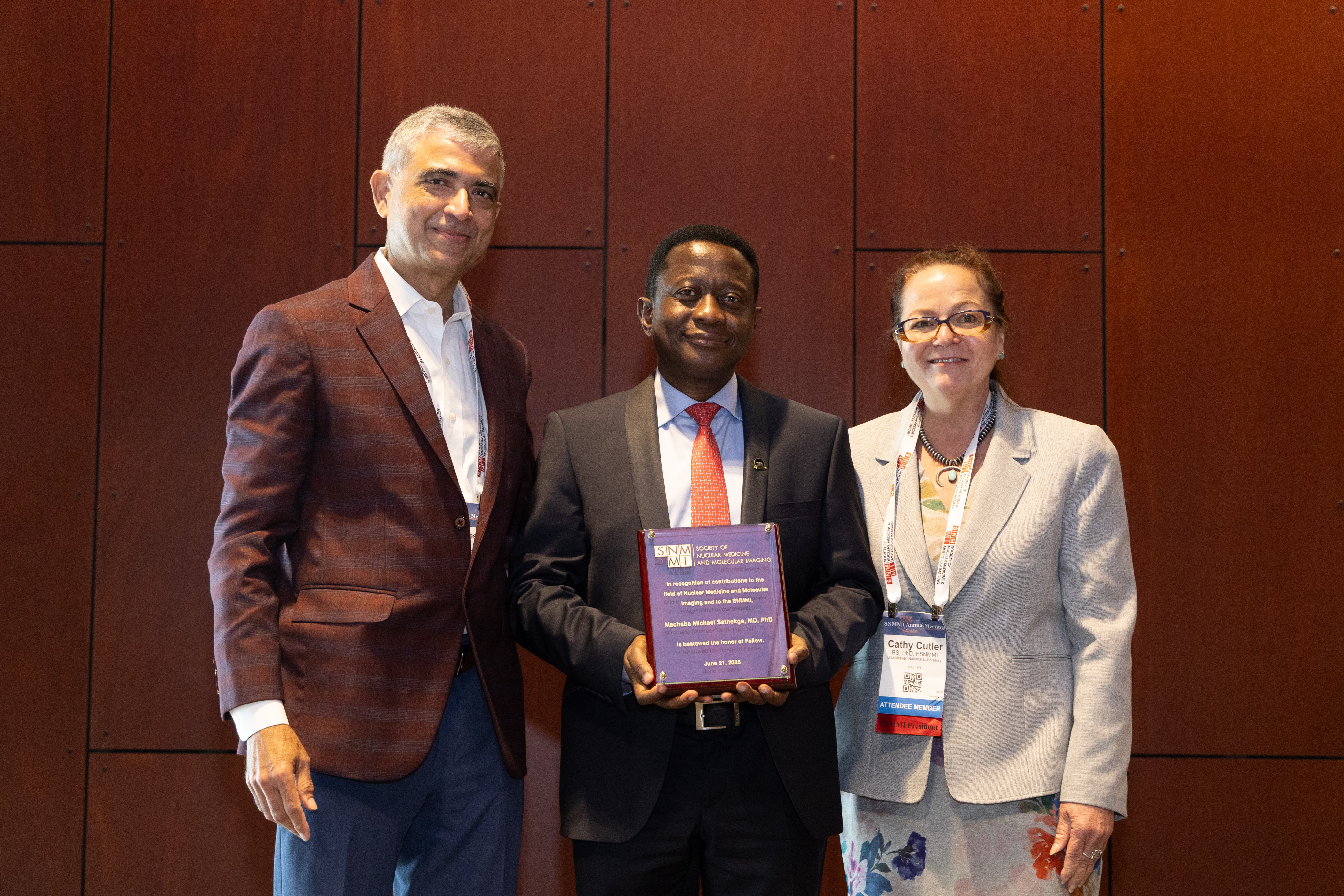 Professor Mike Sathekge receiving dual honours